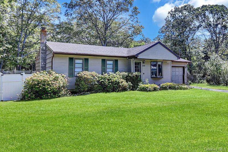 Beautifully maintained ranch with cathedral ceilings in living room and large bay window.