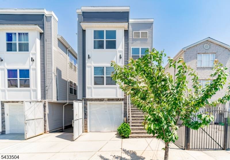 NEWLY BUILT, UNIQUE two family featuring a rare ground level unit with 2 rooms and a full bath, home office, or added flexibility.