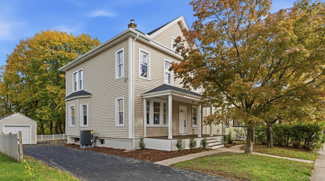 Step into this Beautifully renovated Colonial featuring a stunning kitchen with quartz countertops, custom cabinetry, and stainless steel appliances.