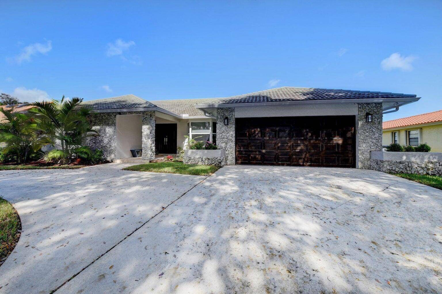 Step through the front door and be instantly captivated by a breathtaking waterfront view that sets the tone for this tranquil, beautifully designed home.