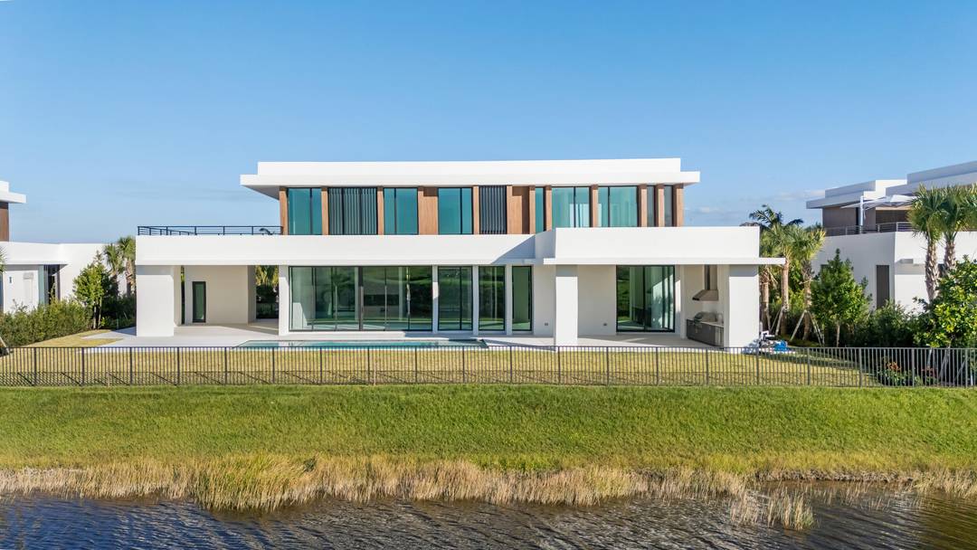 Welcome to 10947 Monte Rosa Drive, situated in Palm Beach County's highly coveted new golf community, Panther National.