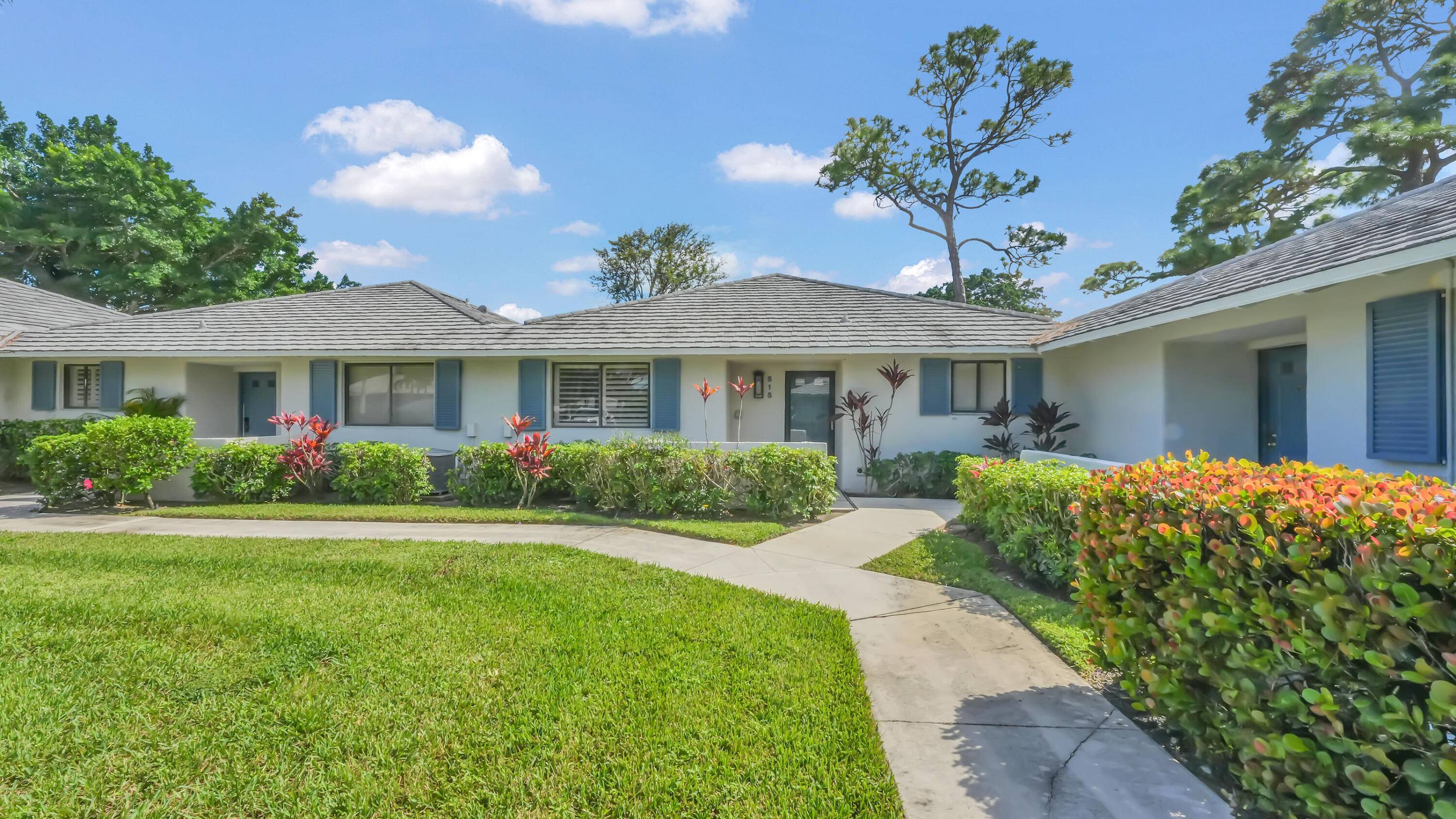 Experience resort style living in PGA National with this fully furnished 2 bedroom, 2 bath end unit villa overlooking the golf course.