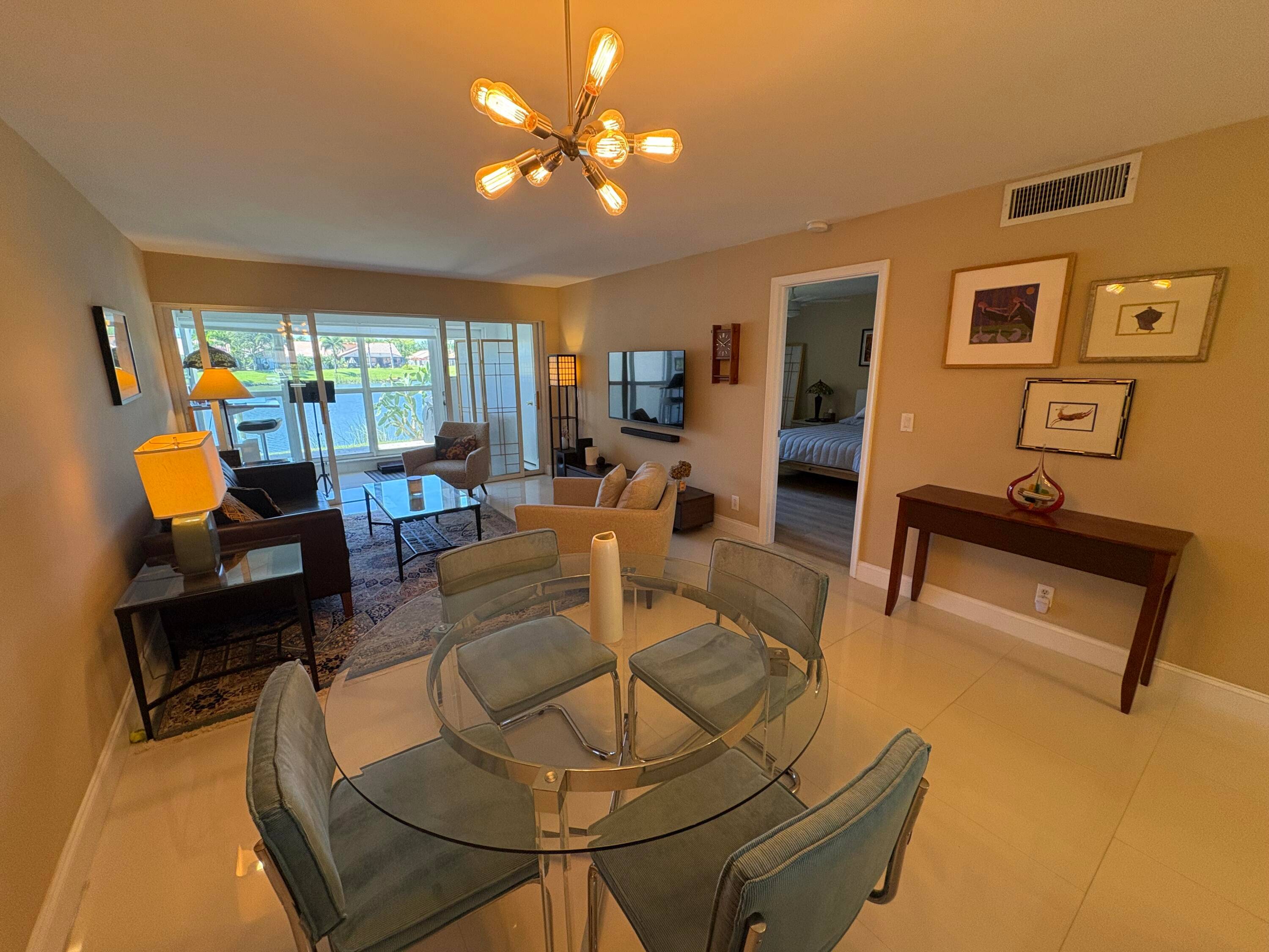 Come and tour this Outstanding, 1st floor, Waterfront, Remodeled 2 bed, 2 bath Pines of Delray North condo with including newer high end furnishings, new high end shades, new TV ...