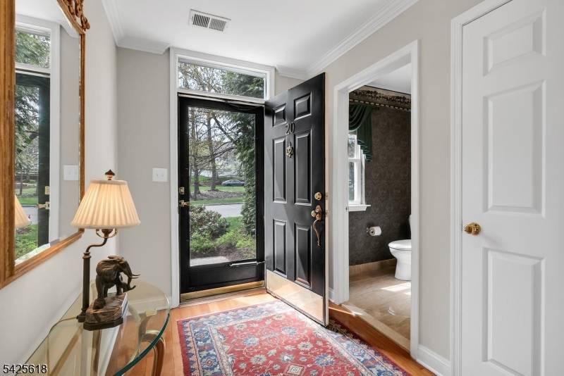 Welcome to this beautifully maintained two bedroom, two and a half bath townhome with refined living and a finished walkout basement nestled in one of the Hills' most coveted townhome ...