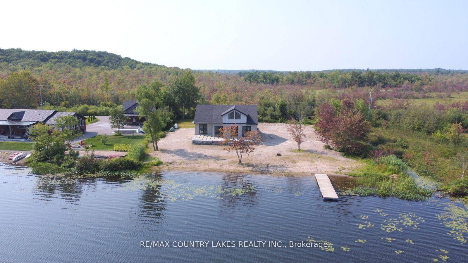 This exceptional 4 bedroom, 4 year old custom built home boasts 171 feet of prime waterfront on the serene shores of Head Lake.