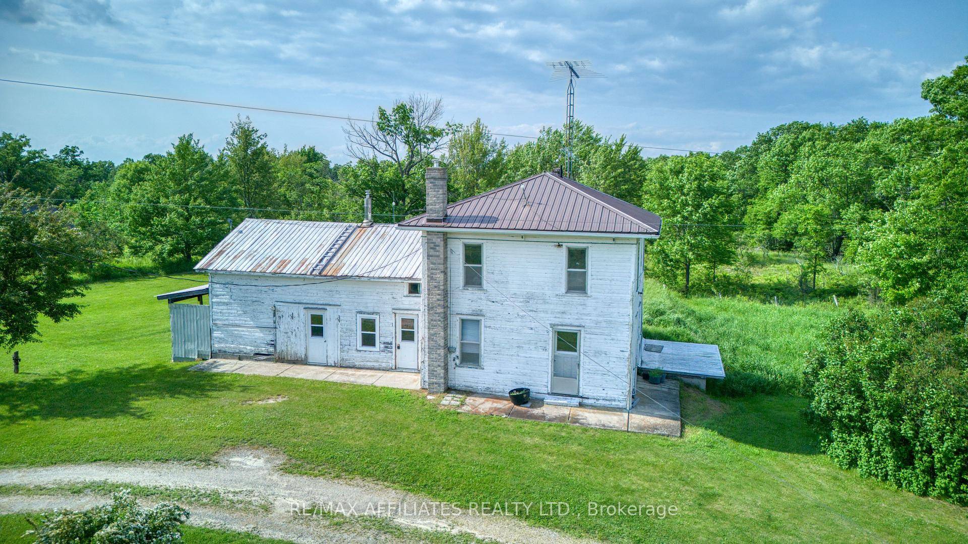 Welcome to a unique opportunity to own a stunning piece of paradise with this charming farmhouse retreat, being sold as is, situated on an expansive 473 acre estate.
