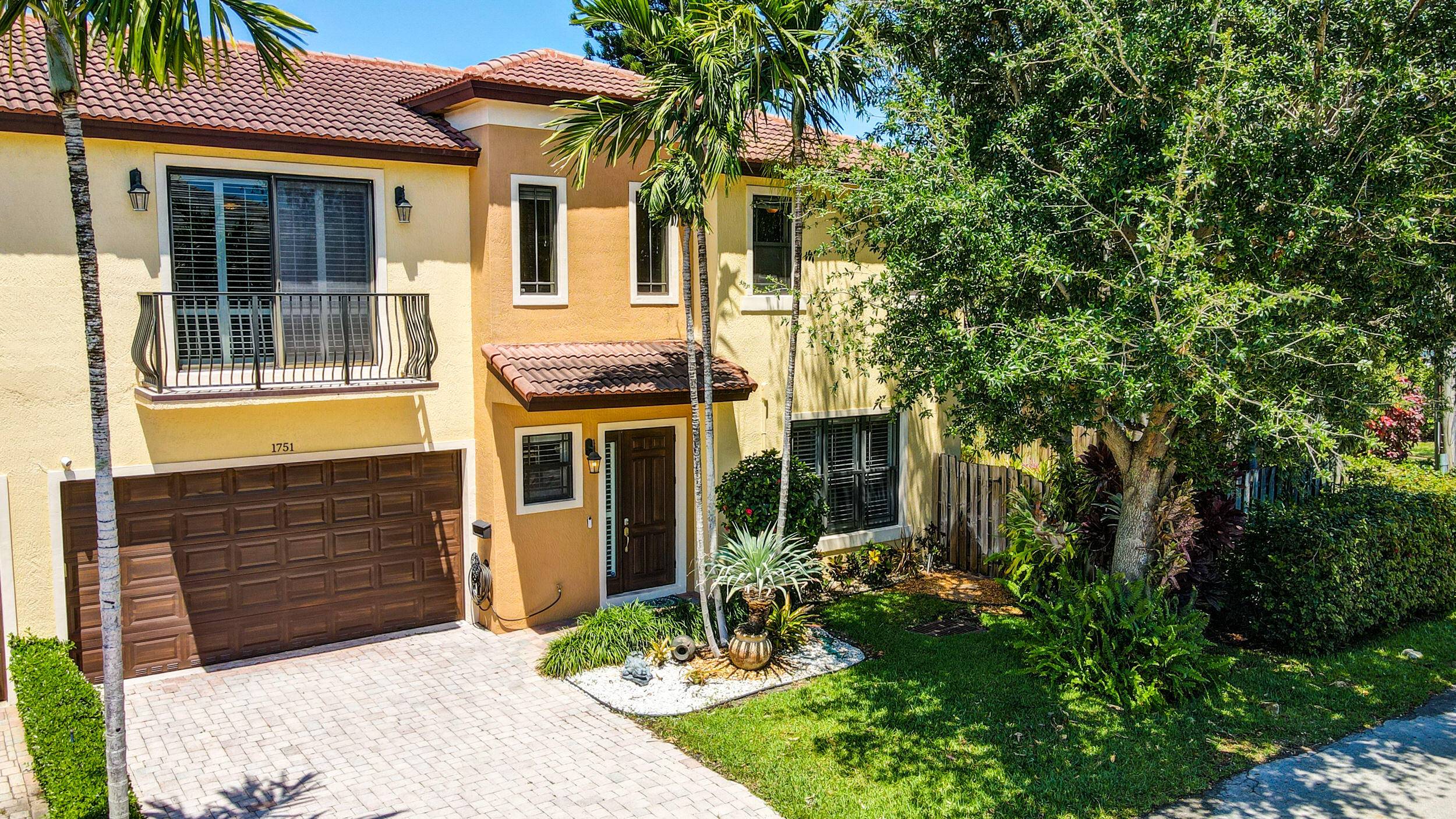 Spacious modern 3 bed 2. 5 bath corner townhome featuring a private tropical pool backyard space, an open plan kitchen with Quartz counters and bar seating, tile floors throughout the ...