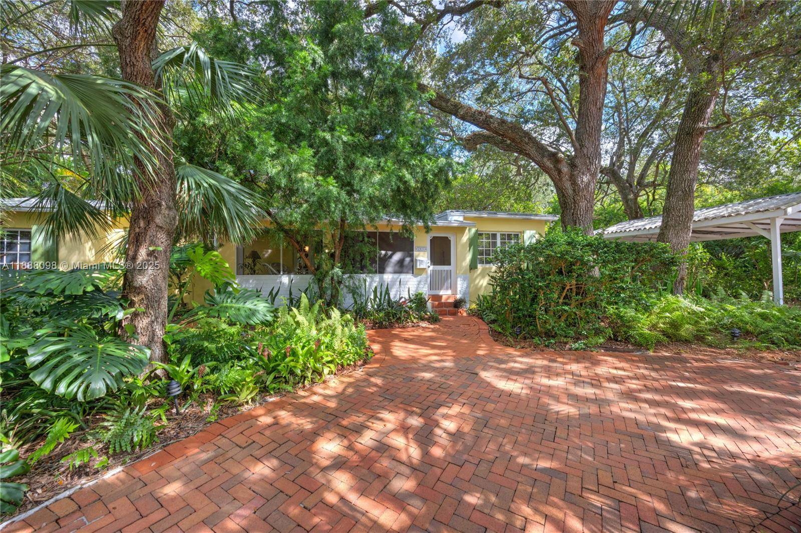 Old Florida design built right open kitchen, dining room, split bedrooms, metal roof, circular drive, screened front porch, large back patio and carport on a quarter acre with magnificent trees ...