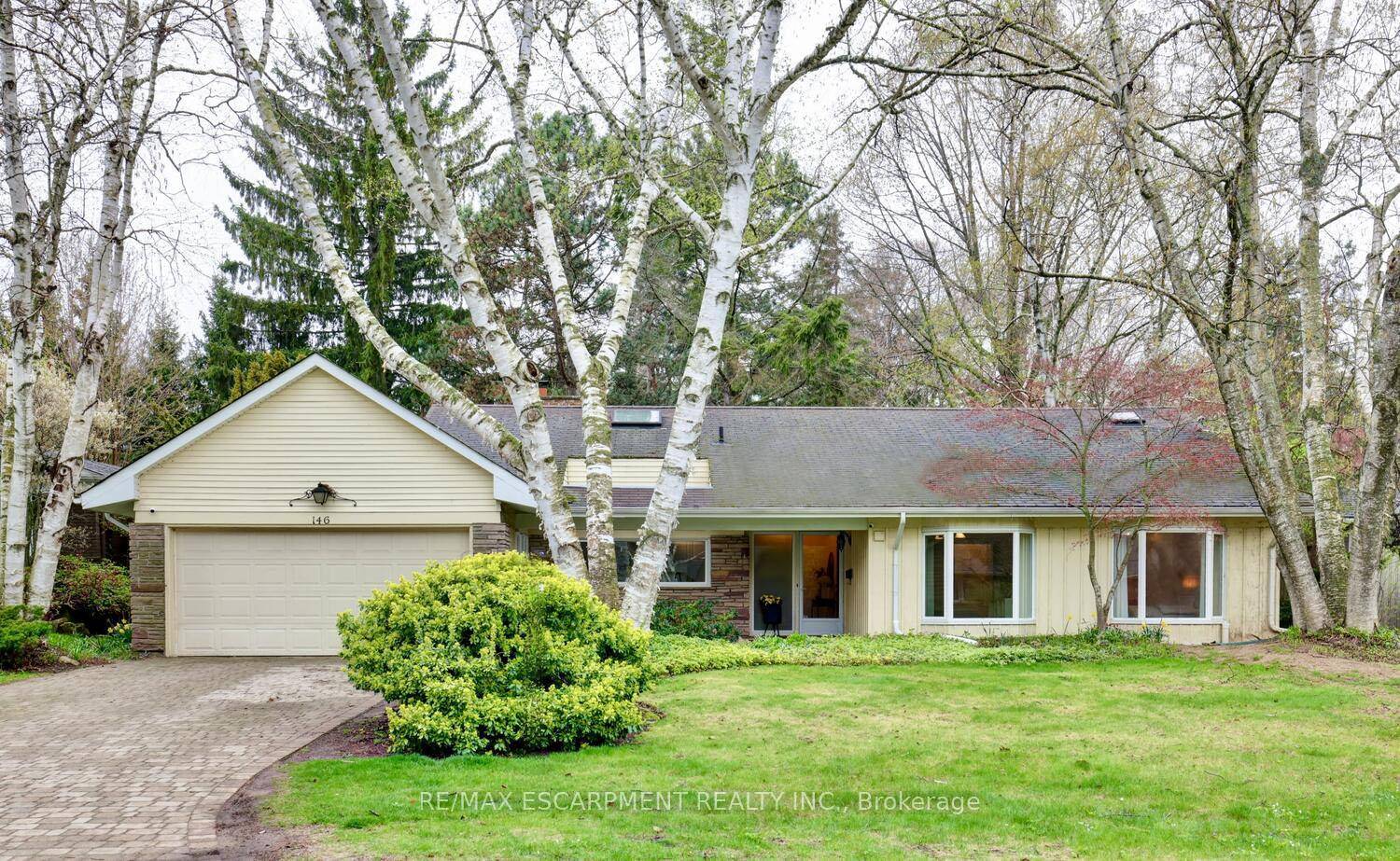 Gracefully nestled on a sprawling 80 x 140 lot, this elegant bungalow is surrounded by towering mature trees and just close enough to the lake to hear the gentle lapping ...