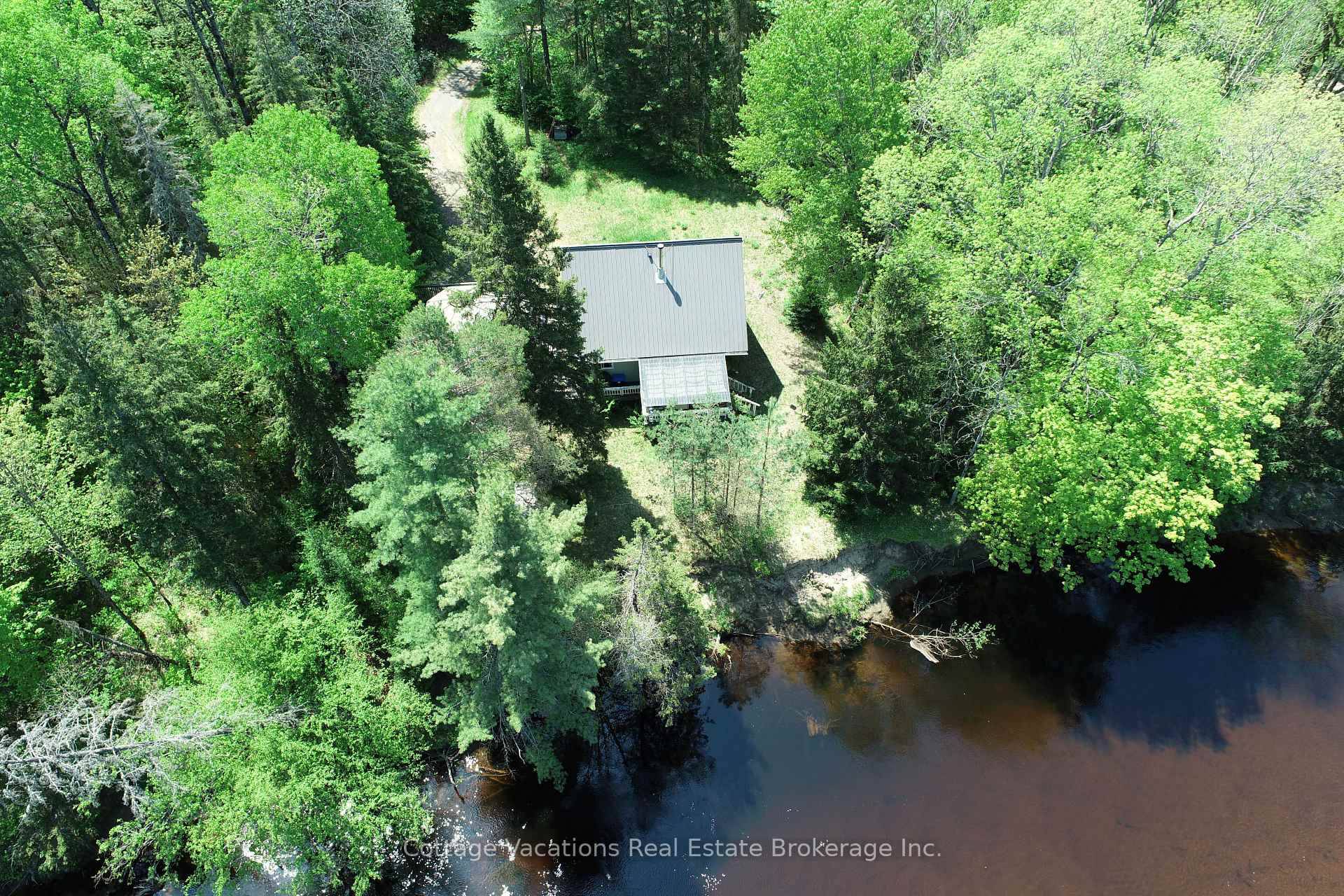 This 4 season, Chalet style home or cottage, sits on a very private lot with 390ft of frontage along the Big East River with a fantastic beach area.