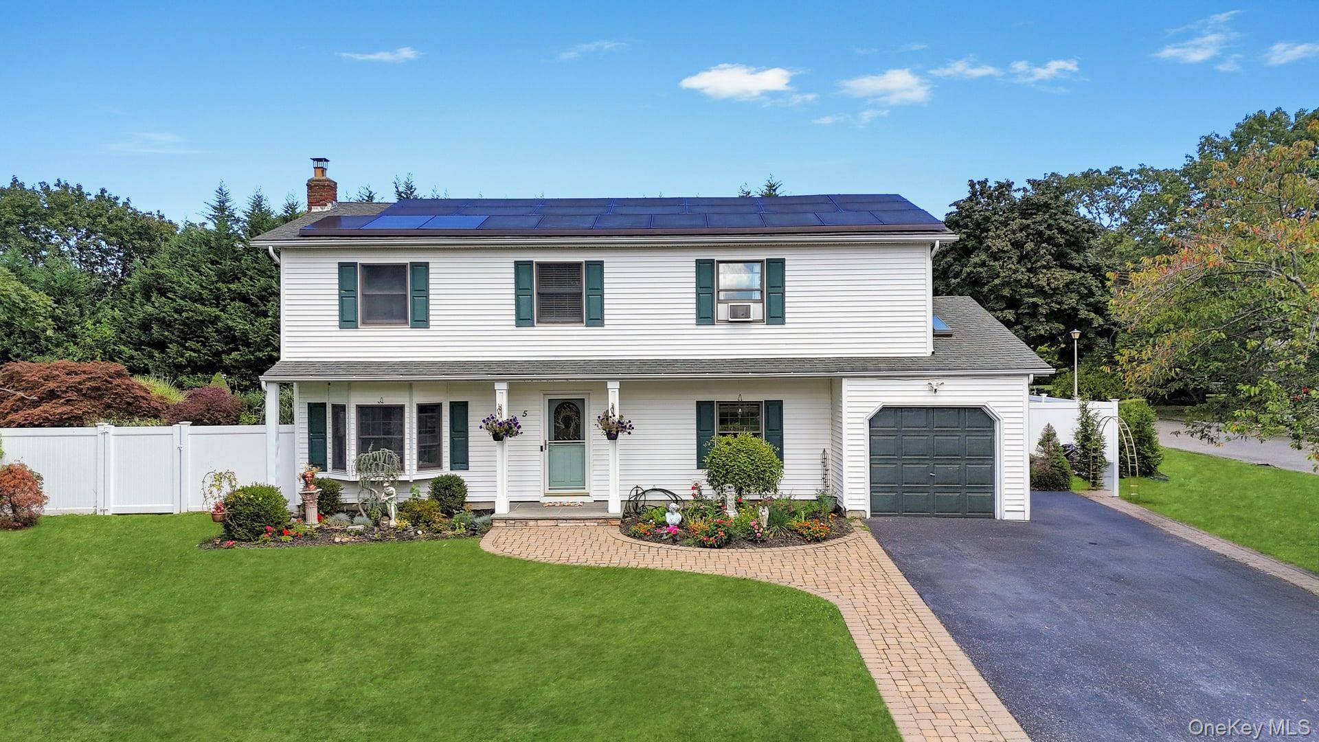 Your search is over ! This magnificent Colonial is set in a lovely neighborhood within the Comsewogue School District, situated on over a half acre of picture perfect grounds.
