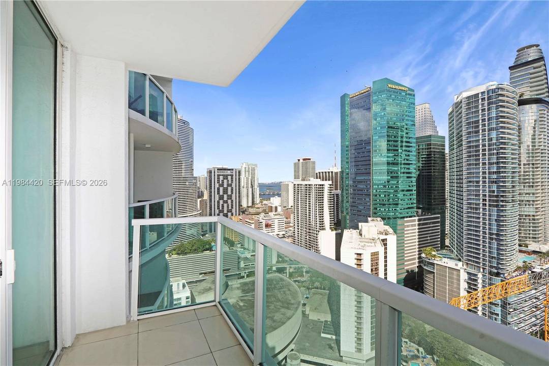 Spacious 2 bedroom, 2. 5 bath residence in the heart of Brickell featuring high ceilings, two private balconies, and in unit washer and dryer.
