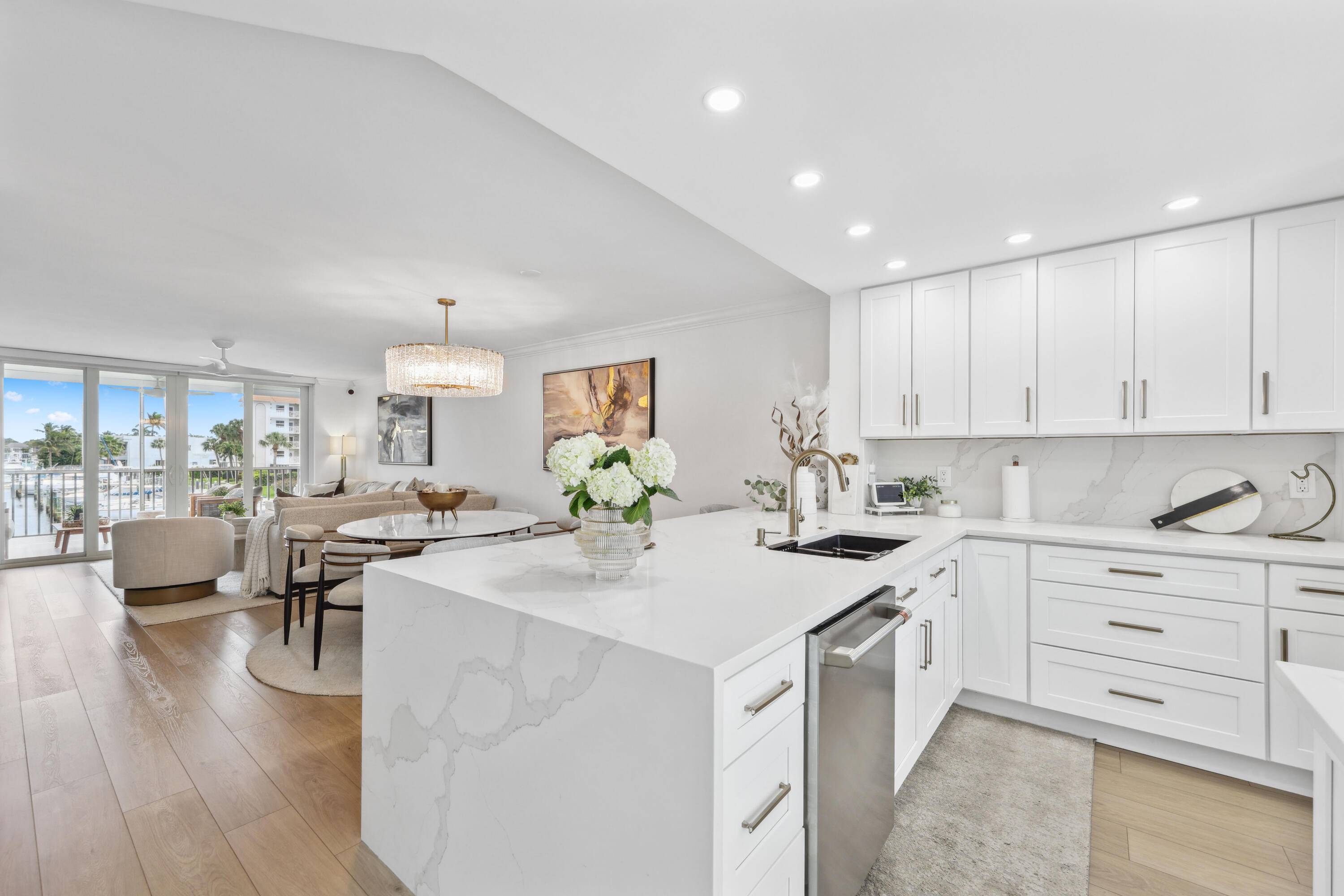 Gorgeous design inspired completely updated waterfront condo with impact front door, sliders and windows in the East Delray Beach community of Tropic Bay.