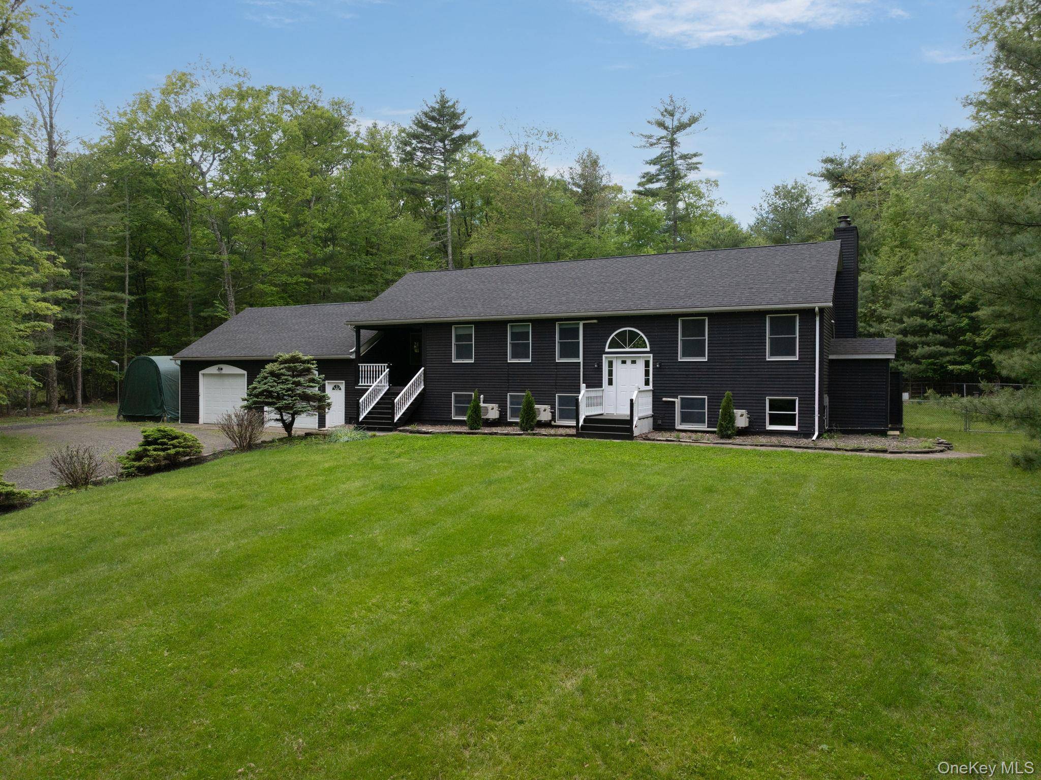 Nestled on a serene country road, this turnkey, beautifully maintained home offers exceptional comfort, privacy, diverse living spaces, and a host of modern updates ideal for relaxed living.