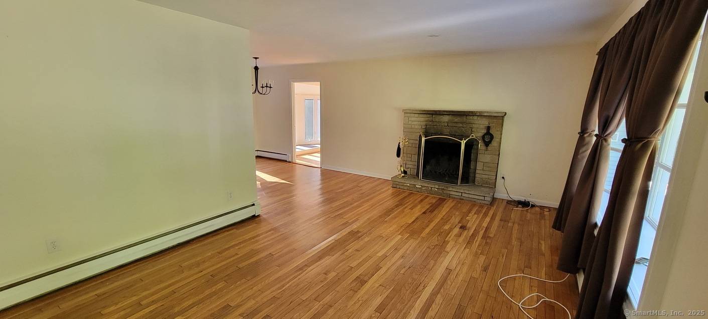 4 bedroom 2 bath ranch style home in private setting, hardwood floors through out, updated kitchen and bathrooms, dining room, den, living room with fireplace, primary bedroom with its own ...