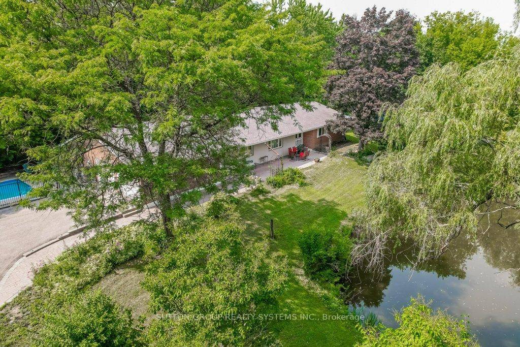 Rare, beautifully treed property offering serene natural beauty and privacy on 1.