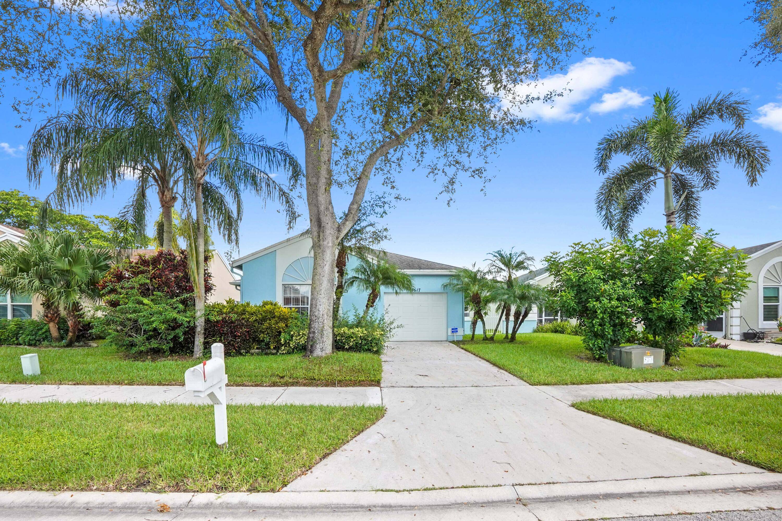 Welcome to this exceptional waterfront villa, perfectly situated in a beautifully maintained Delray Beach community known for its picturesque lakes and incredible amenities.