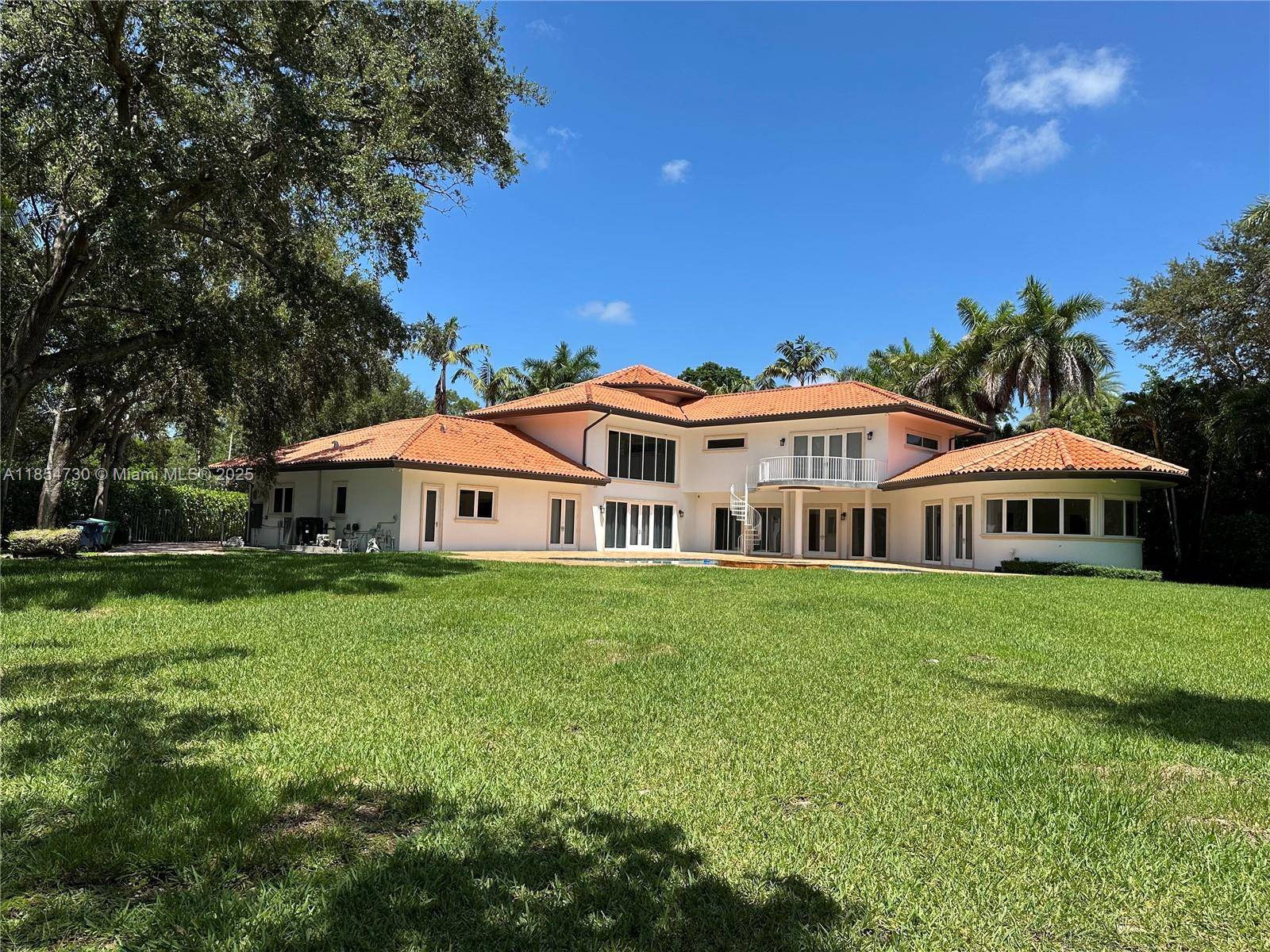 Gorgeous, gated estate spans 5, 849 sq ft on 40, 519 sq ft of land, offering 6 spacious bedrooms and 4.