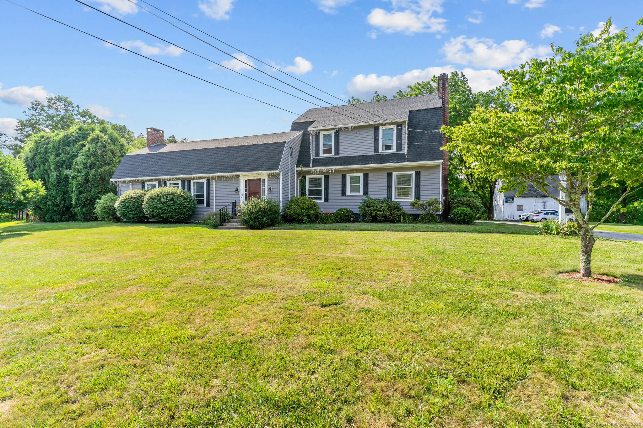 Welcome to this expansive Colonial style home offering 5 bedrooms and 5 full bathrooms, nestled on a picturesque 2 acre lot.