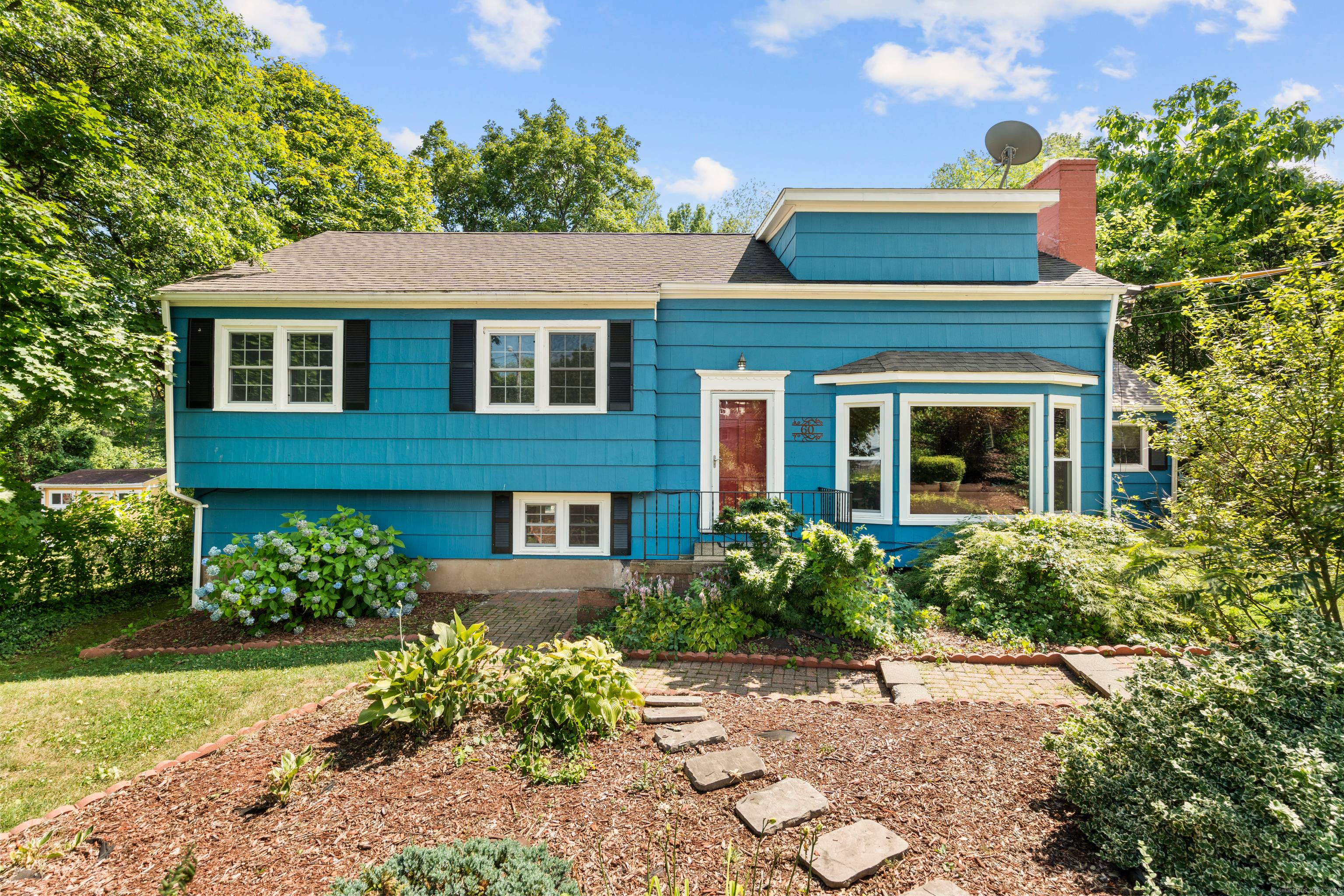 Tucked into Hamden's highly desirable Whitneyville neighborhood, this multi level residence delivers space, flexibility, and thoughtful updates across four finished levels.