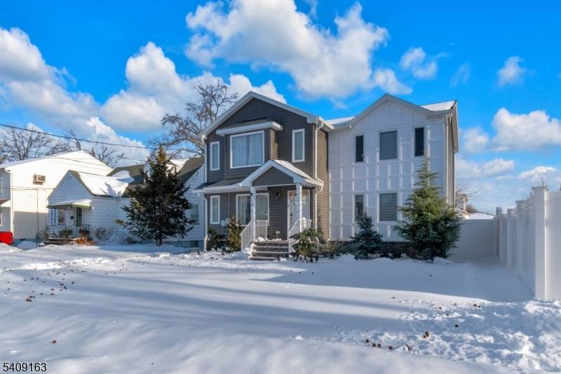 Welcome to 112 E 12th Street a beautifully updated 4 bed, 4 bath Colonial offering comfort and style throughout.