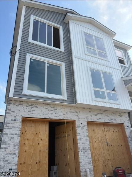Welcome to this stunning New Construction, 2 Family Home, Offering the Perfect blend of Modern design, Comfort and Functionality the top floor features 4 spacious bedrooms and 2 full bathrooms ...