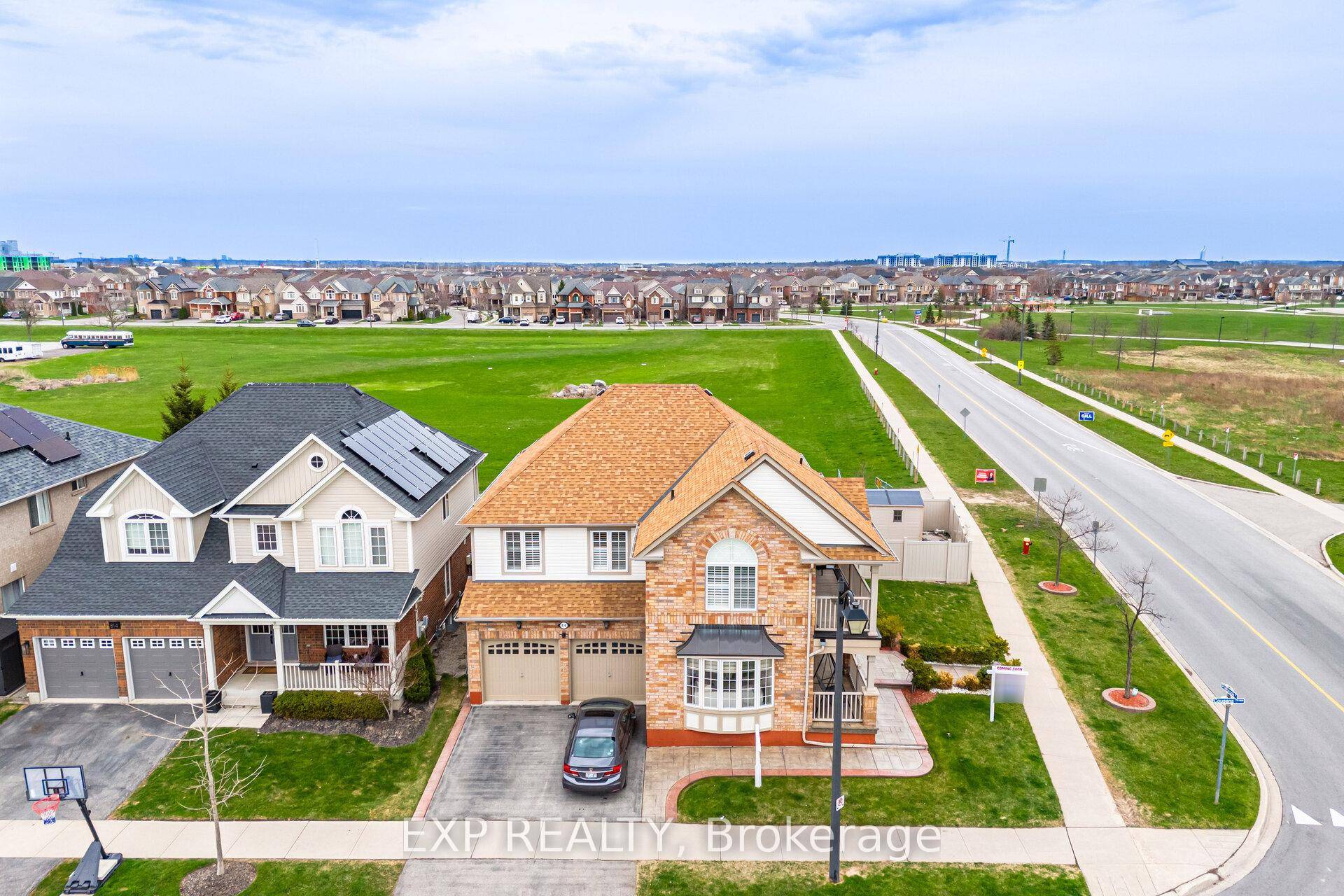Jaw dropping views from every window in this sun drenched, corner detached home, sitting on a whopping 71 foot wide lot, fronting schools and parks right at your doorstep !