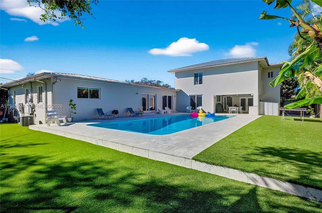 Modern, move in ready private oasis on an oversized corner lot in the heart of Biscayne Park.