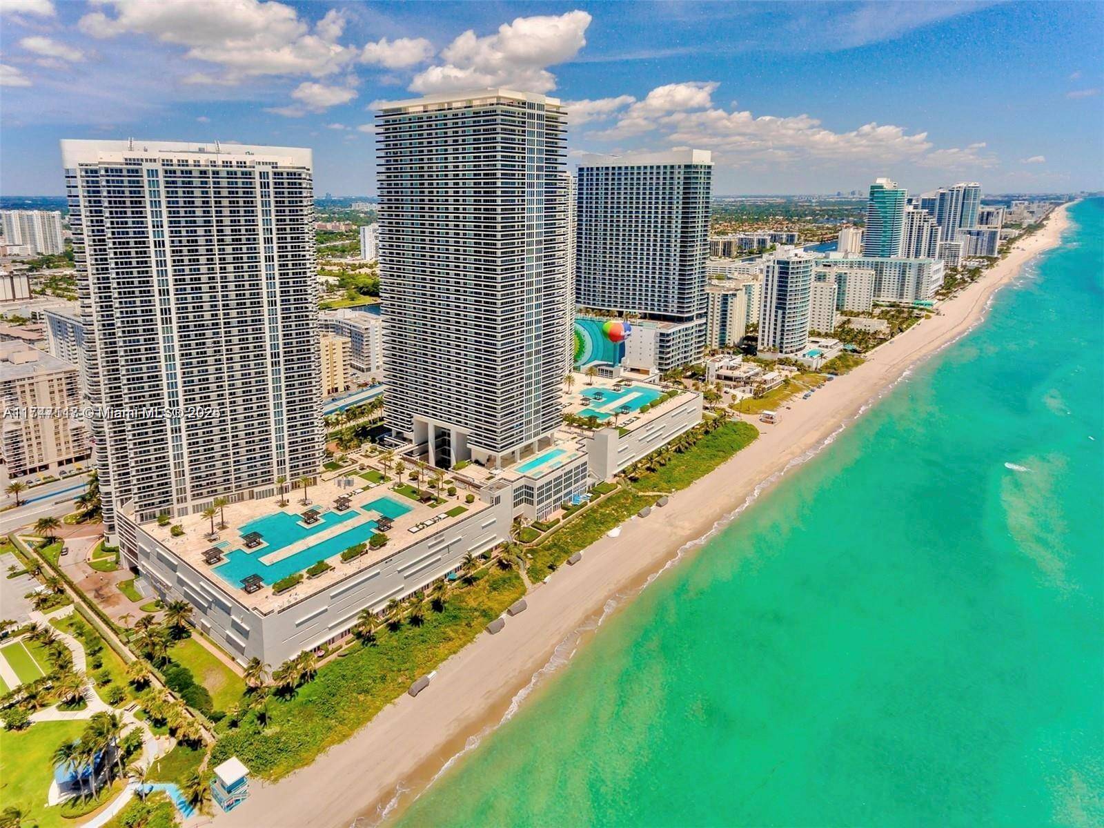 Stunning high floor 2BD Den 3BA condo in Hallandale Beach with breathtaking intracoastal and city views.