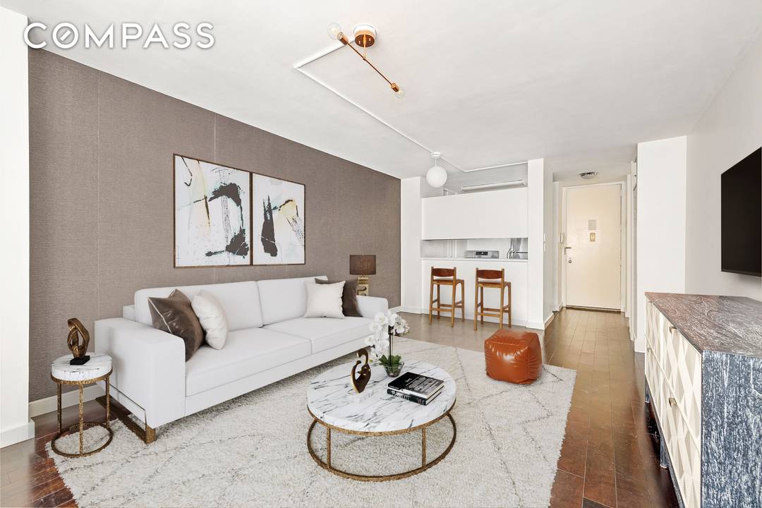 Residence 8D at the Cosmopolitan Condominium is the epitome of sophisticated city living, offering a spacious south facing one bedroom.