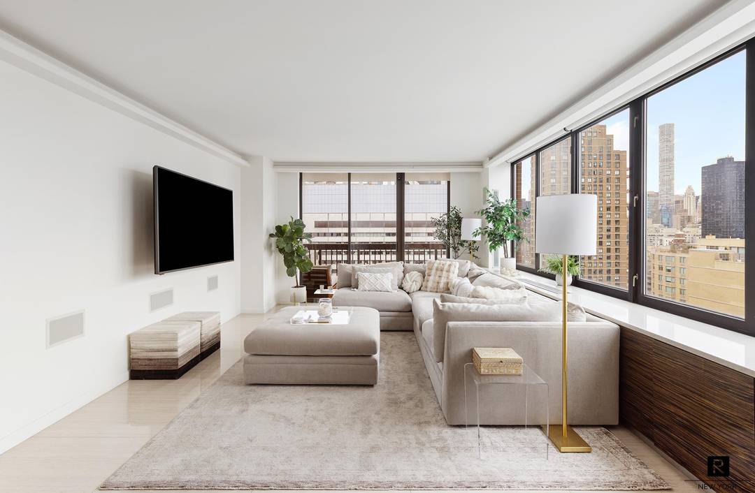 Bright designer two bedroom, two bath corner residence at The Oxford, featuring south and west exposures and a generously proportioned balcony with open city views.