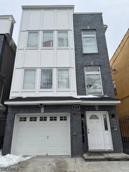 Newer Three Family Home Built in 2021 Located near West Side Park, GS Parkway University Heights Featuring Brick Front, Hardwood Floors, Central Air, Granit Counters Tops, Stainless Steel Appliances, Low ...