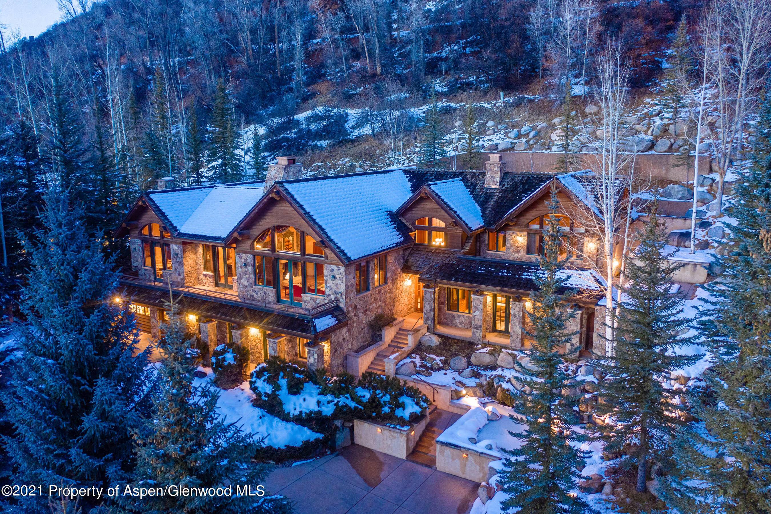 Located on the coveted Willoughby Way, this finely crafted stone masterpiece is the ultimate in privacy, proximity to town, and all encompassing views.