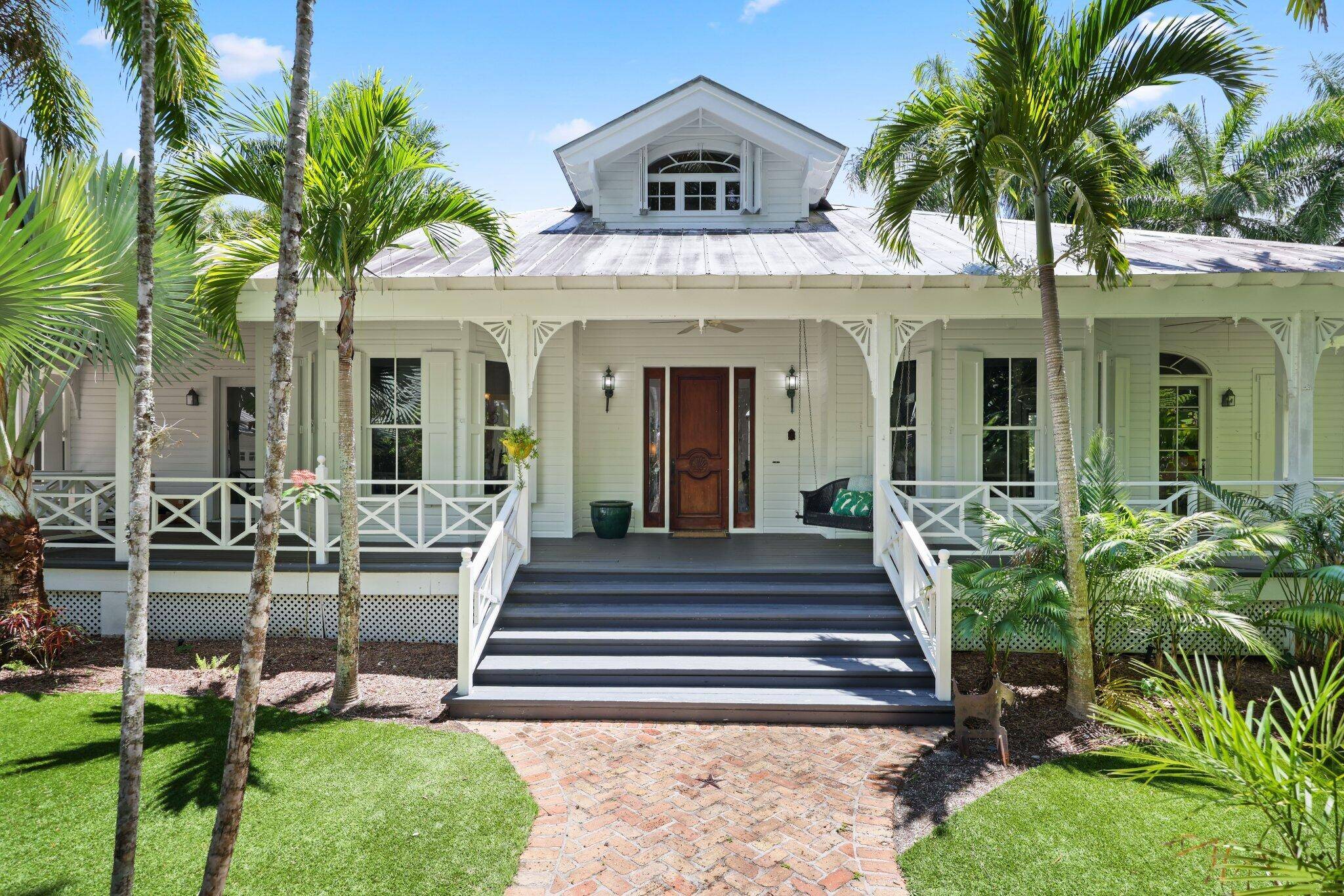 Welcome to your own private oasis in this authentic Key West style home, where every detail captures the essence of tropical living.