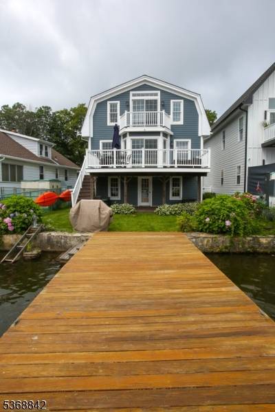 Enjoy the Lifestyle of Lake Living with this Fantastic Custom Lakefront Home features include 3 Spacious Bedrooms, 2.