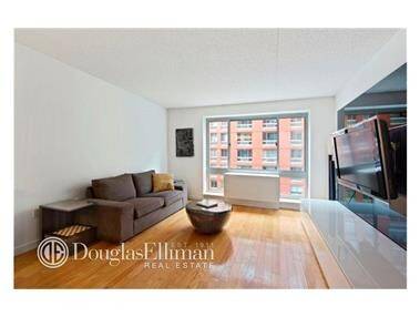 This large, one bathroom home boasts light, oversized windows and pristine hardwood floors throughout.