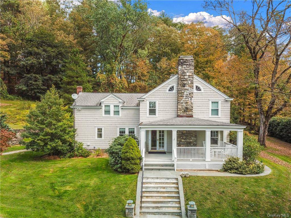 This 1928 Old Style Colonial home is filled with charm and beauty.