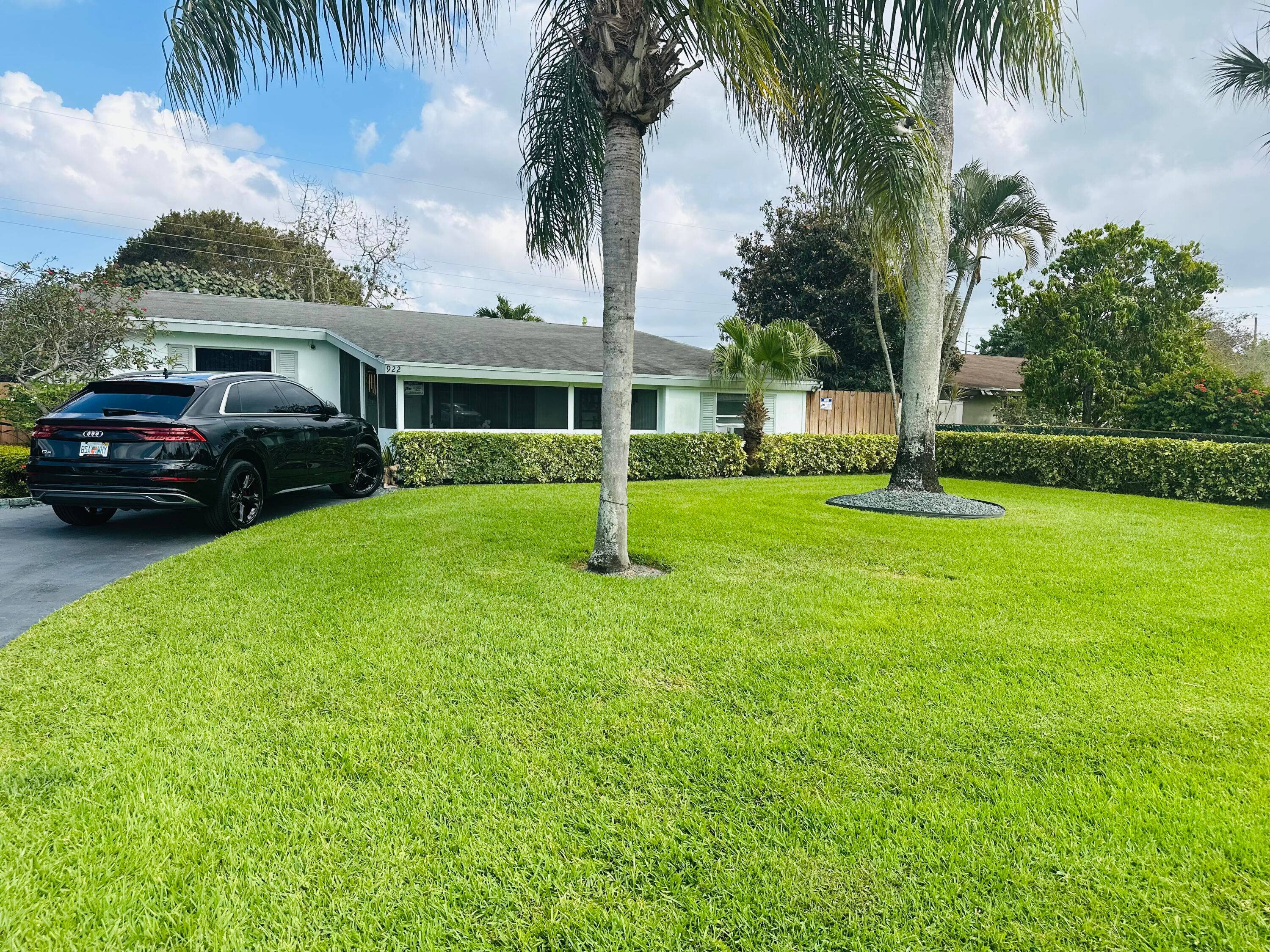 NO HOMEOWNERS ASSOCIATION Beautiful property with 2 roofed screened patios tiled floors updated kitchen with stainless steel appliances bathrooms updated huge front yard and backyard beautifully landscaped Yard Fully Fenced ...