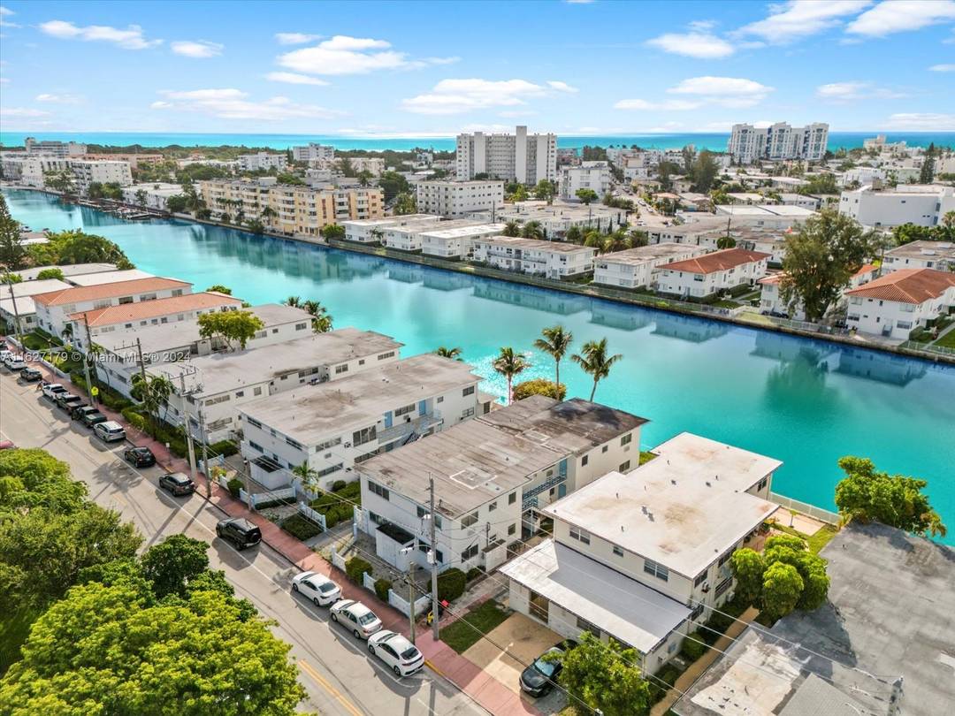Two waterfront buildings on Tatum Waterway in Biscayne Point, Miami Beach across from Crespi Park.