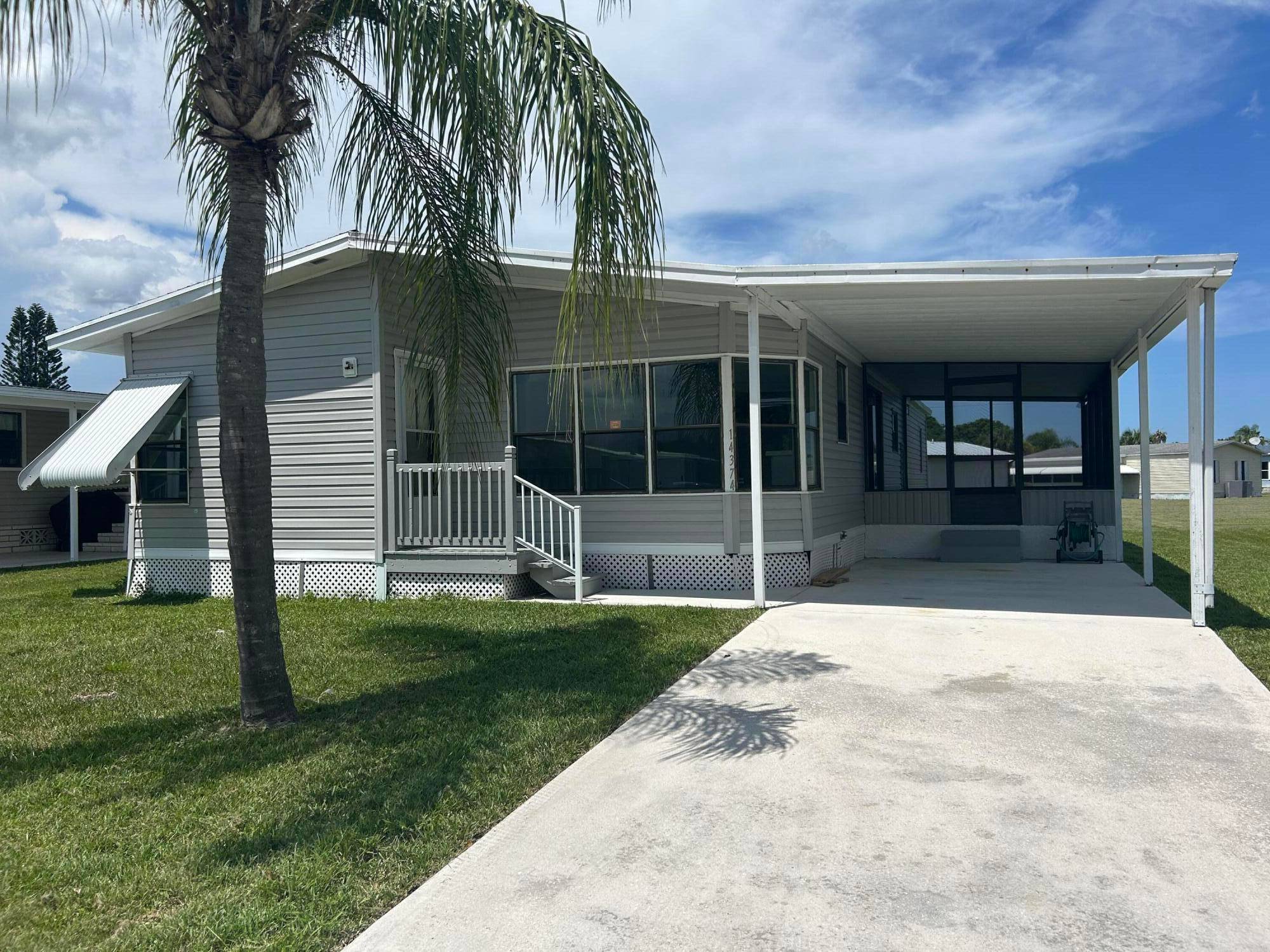 Welcome to 14374 Cancun Ave, a spacious and well maintained mobile home located in the desirable Spanish Lakes community.