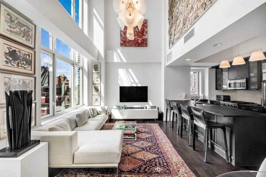 This spectacular, contemporary, light filled condo with soaring 20 foot ceilings, three bedrooms, and three bathrooms is located in the heart of Lenox Hill.