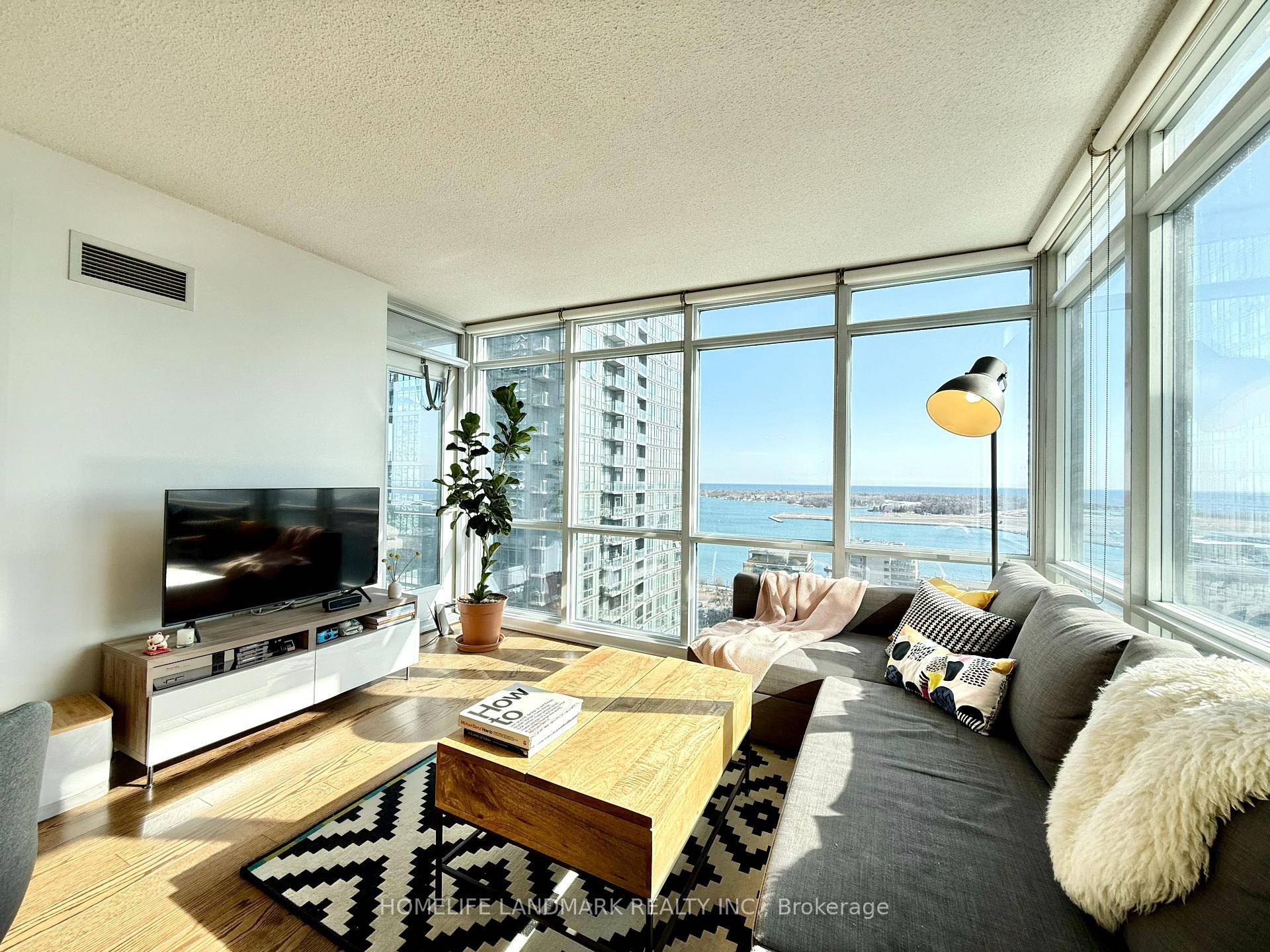 Wake up to breathtaking views of the CN Tower and Lake Ontario in this bright, beautifully maintained 2 bedroom den, 2 bath suite in the heart of downtown Toronto.