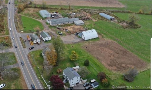 2 Residential and several commercial outbuildings on 4.