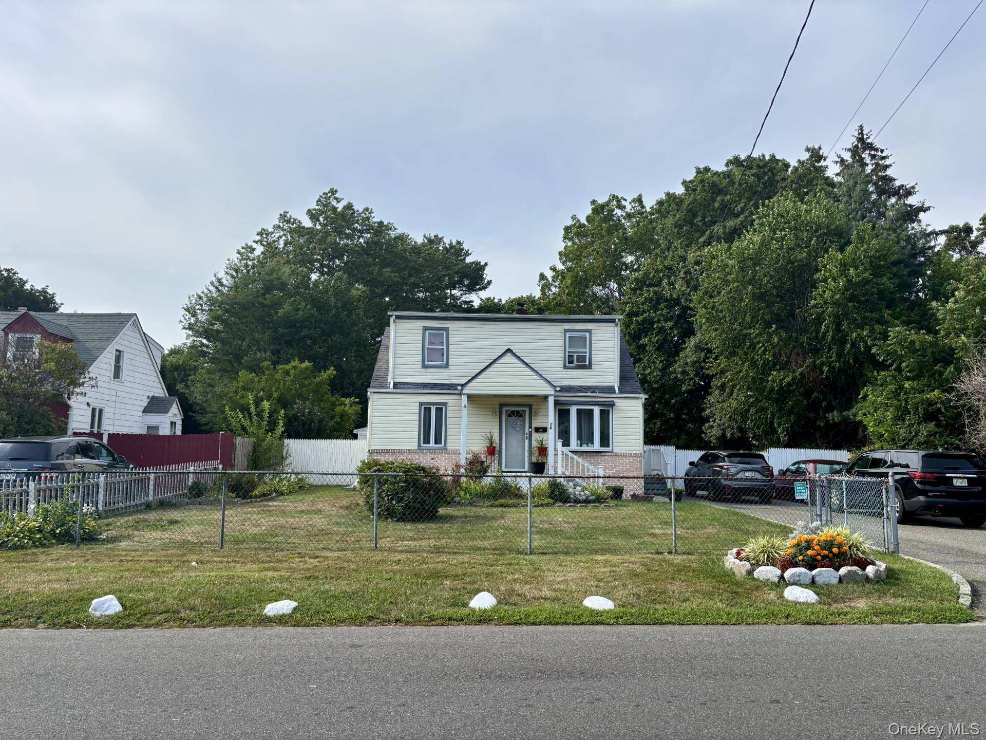 Welcome to this charming Cape on 1 2 an Acre of Land !