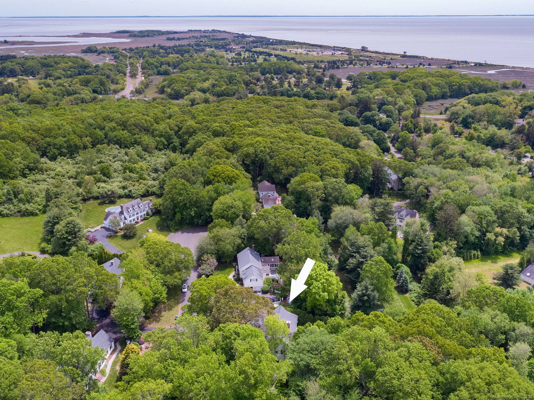 Just minutes from Madison's beautiful beaches and vibrant town center, this exceptional architect designed home sits on a quiet o cul de sac street.