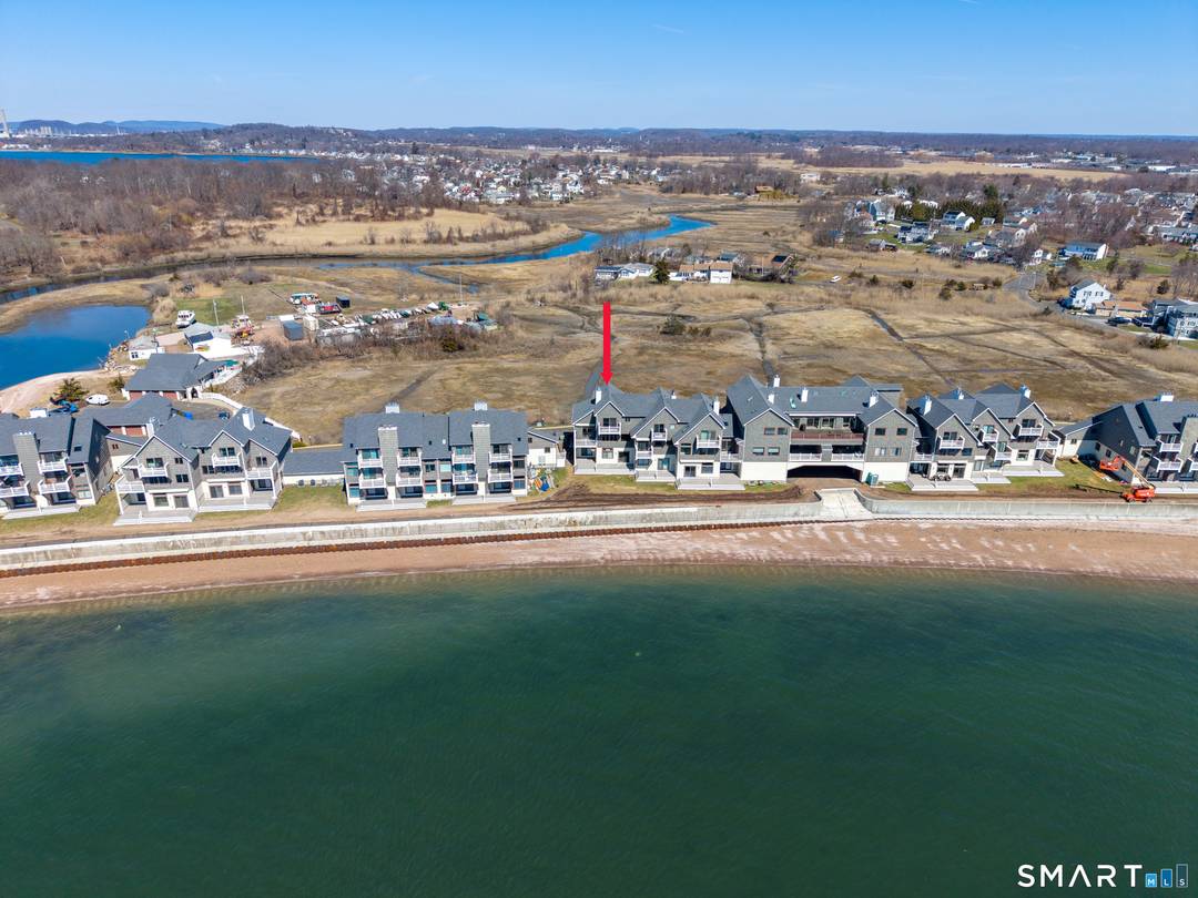 Wake up to shimmering water, endless horizons, and million dollar views from this exquisitely remodeled waterfront townhome.