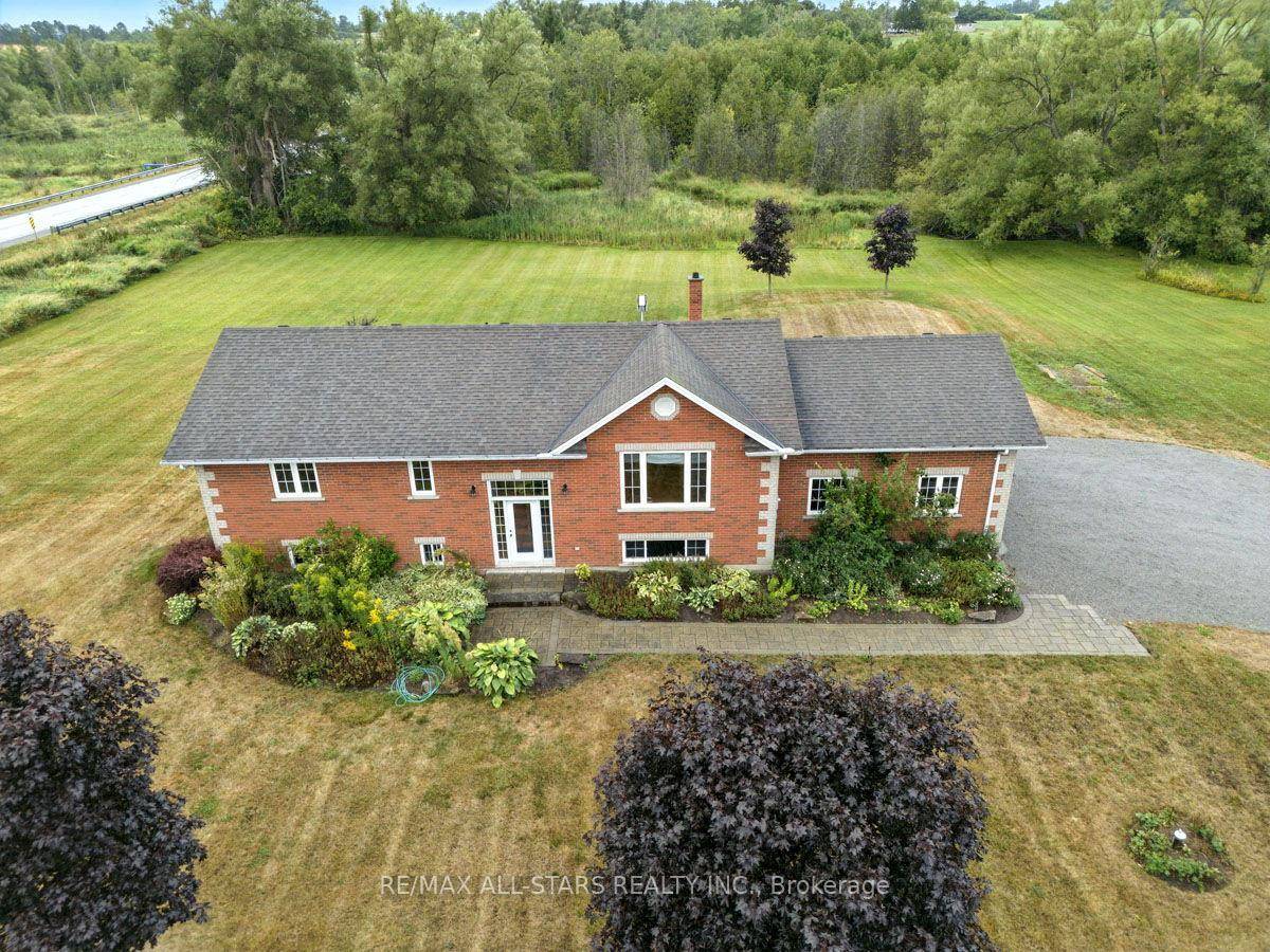 Beautiful 2 2 bedroom raised bungalow on 2 acres with park like setting backing onto a creek.