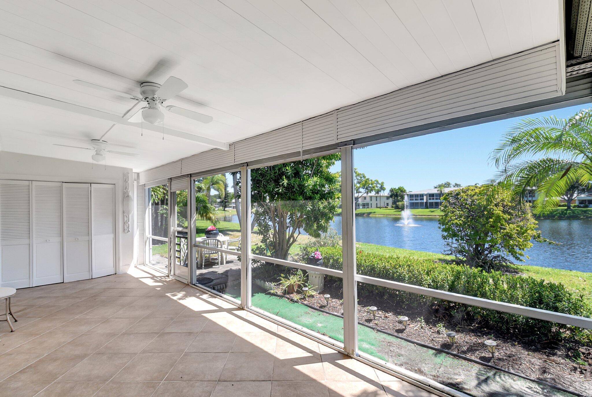 Welcome to this beautiful single story lakefront villa in The Pines of Delray North Community !