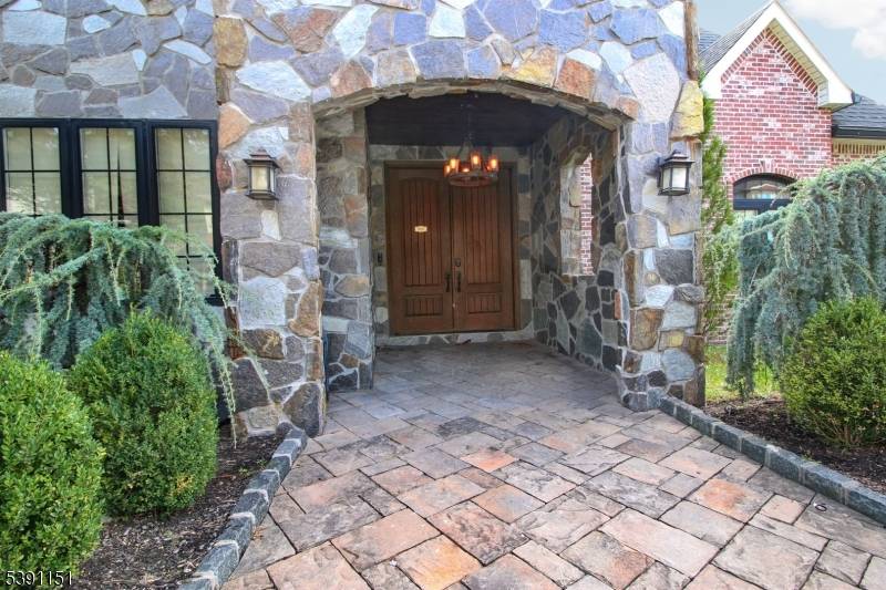 Perched high above the skyline with sweeping panoramic views, this striking young luxury home captures the essence of modern elegance and effortless indoor outdoor living.