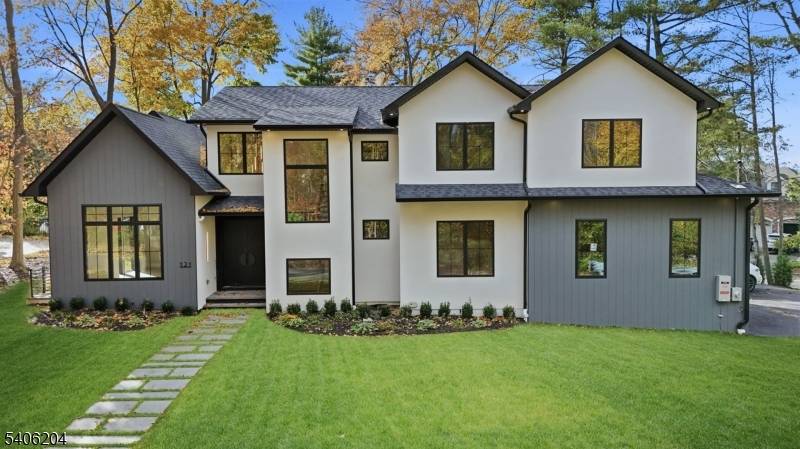 Luxury takes center stage in this remarkable new custom home offering over 6700 sq ft of beautifully finished living space on 0.